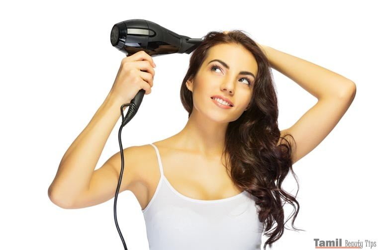 girl use hair drier